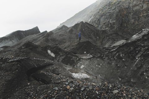 Man walking on rock in Skaftafell, Iceland