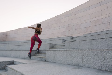 Woman running up steps