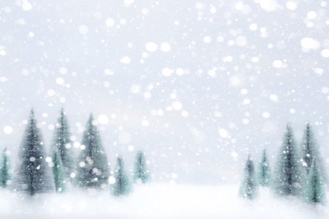 Snow falling on Christmas tree ornaments