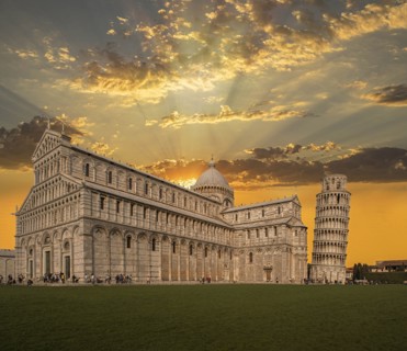 Leaning Tower of Pisa and Piazza dei Miracoli at sunset in Tuscany, Italy