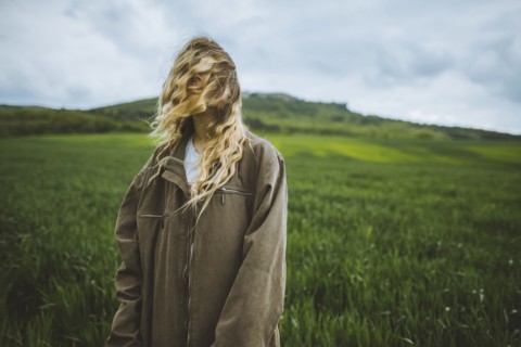 Windswept woman in field in Crimea, Ukraine