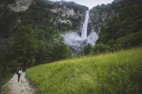 Woman on path to waterfall