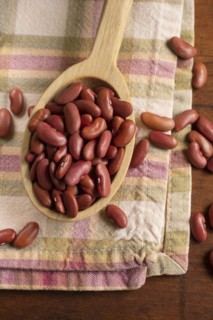 Kidney beans on wooden spoon
