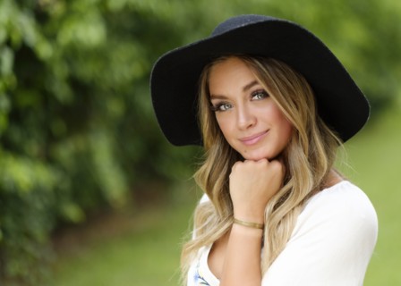 Portrait of young woman in floppy hat