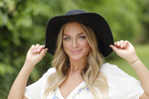 Portrait of young woman in floppy hat
