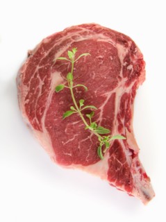 Raw steak and oregano