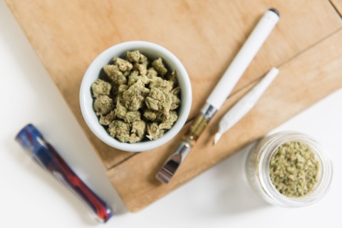 Bowl of marijuana with electronic cigarette and joint