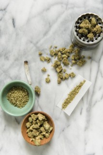 Marijuana with bowl, grinder, and rolling paper