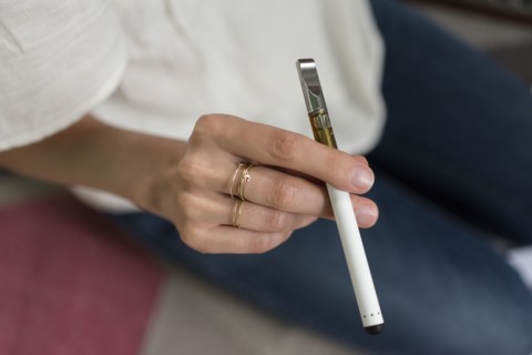 Hand of woman holding electronic cigarette