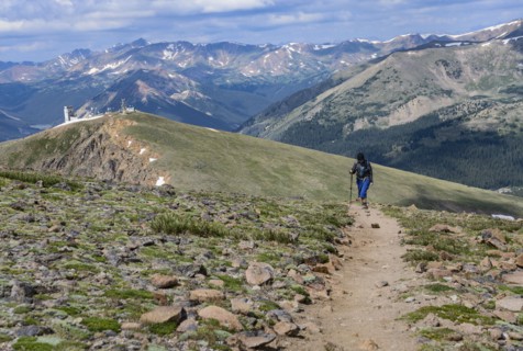 Woman hiking trail on Berthoud Pass Trail in Colorado