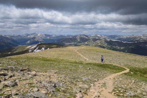 Woman hiking trail on Berthoud Pass Trail in Colorado