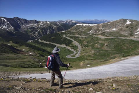 Hiker looking at view of mountains at Loveland Pass in Colorado