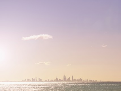 Cityscape and sea at sunset