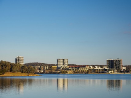 Buildings by lake in Ginninderra, Australia