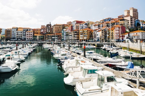 Moored boats and buildings on the waterfront of Bermeo, Spain