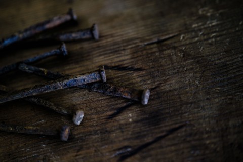 Nails on wooden table