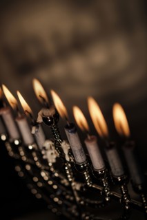 Lit candles in menorah