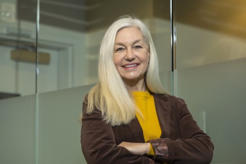 Portrait of smiling businesswoman with arms crossed