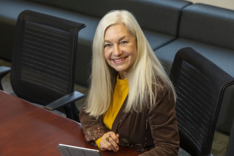 Smiling businesswoman sitting in conference room