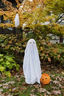 Boy in ghost costume for Halloween