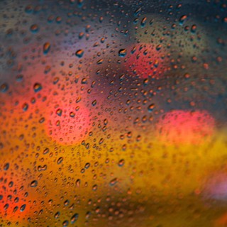 Defocussed light behind wet window