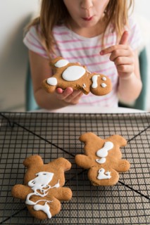 Girl eating gingerbread man