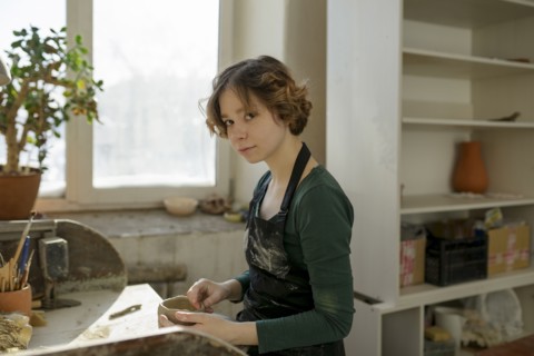 Potter in workshop