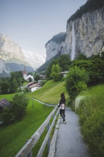 young woman on path by mountain