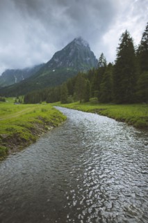 River by mountain in ybersee, Switzerland