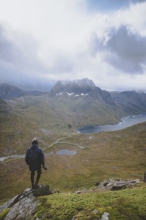young man hiking on mountain in Norway