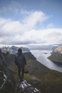 young man hiking on mountain in Norway