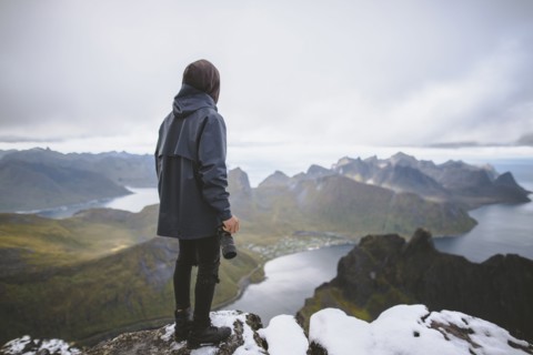young man hiking on mountain in Norway