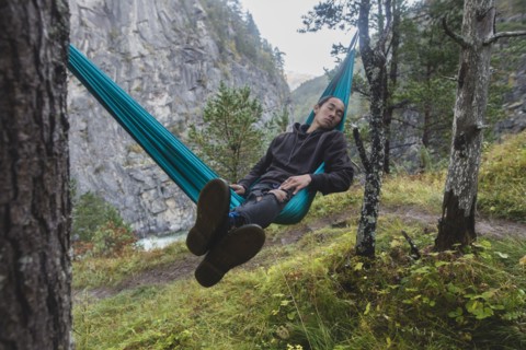 young man resting in hammock