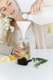 Woman making a homemade natural cleaner