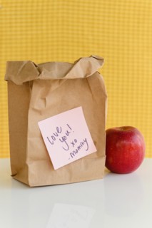 School lunch in paper bag with note from mom