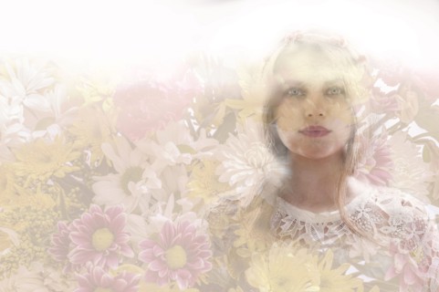 Double exposure of woman and flowers