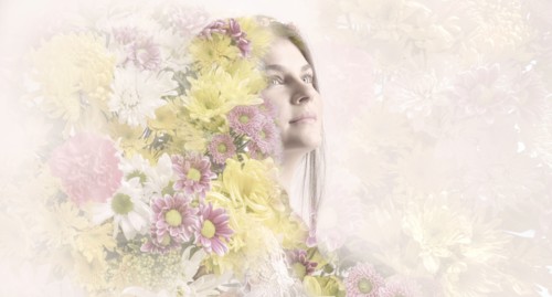 Double exposure of woman and flowers