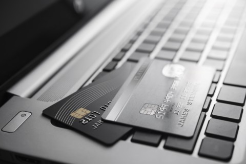 Credit cards on laptop keyboard