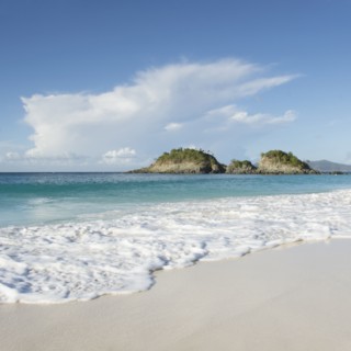 Beach with cliff in distance at Trunk Bay in St. John, Virgin Islands