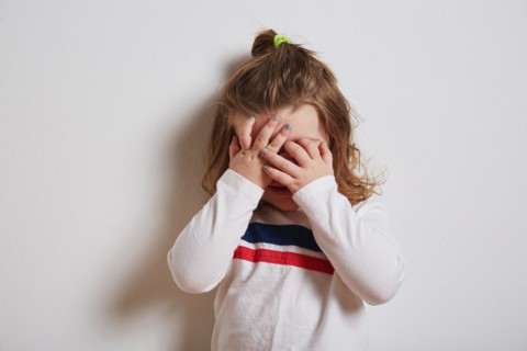 Girl covering her eyes