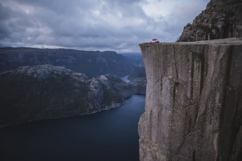 Tent in distance on Preikestolen cliff in Rogaland, Norway