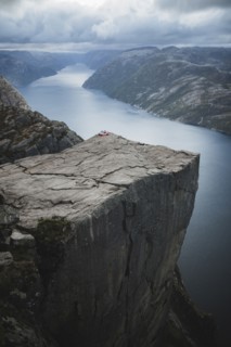 Tent in distance on Preikestolen cliff in Rogaland, Norway