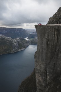 Tent in distance on Preikestolen cliff in Rogaland, Norway