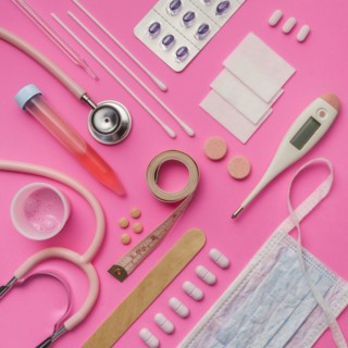 Medical supplies on pink background