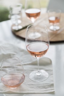 Glasses of rose wine on table