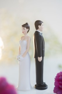 Bride and Groom cake toppers facing away from each other