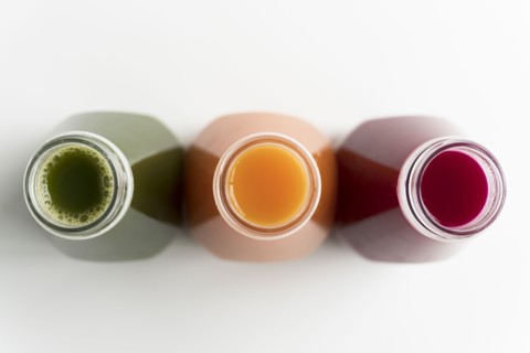 Healthy bottled juices shot from above