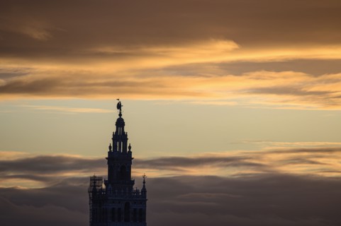 Spain, Seville, Giralda and Catherdral of Seville, Giralda tower against sunset sky