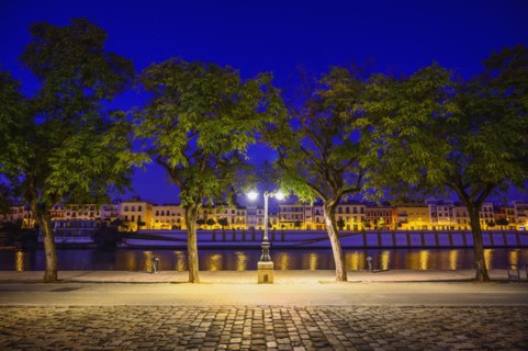 Spain, Andalusia, Seville, Guadalquivir River at night