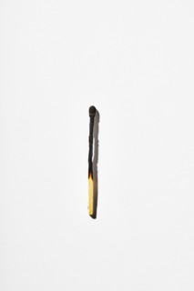 Burnt matchstick on white background